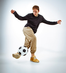 Image showing The portrait of fan with ball on gray background