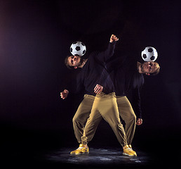 Image showing A portrait of a fan with ball on gray studio background. Freestile