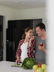 Image showing Young handsome couple in the kitchen