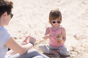 Image showing Mom and daughter on the beach