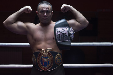 Image showing kick boxer with his championship belt