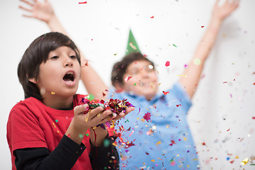 Image showing kids  blowing confetti