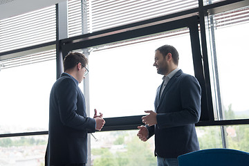 Image showing cloasing the deal in modern office interior