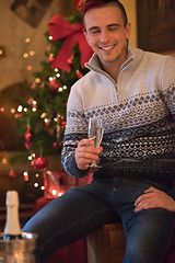 Image showing Happy young man with a glass of champagne