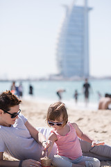 Image showing Mom and daughter on the beach