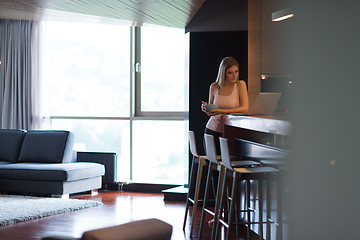 Image showing woman eating breakfast enjoying relaxing lifestyle