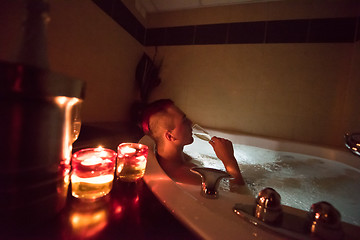 Image showing man relaxing in the jacuzzi