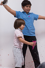 Image showing kids  blowing confetti