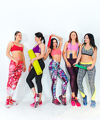 Image showing Group posing in a gym of a fitness center