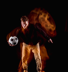 Image showing A portrait of a fan with ball on gray studio background. Freestile