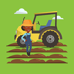 Image showing Farmer standing with tractor on background.