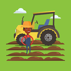 Image showing Farmer standing with tractor on background.