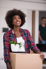 Image showing Black girl moving in the new apartment