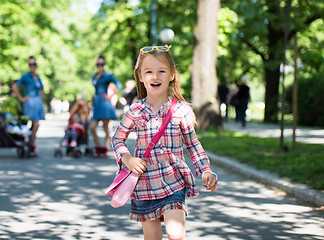 Image showing twins mother with children  in city park