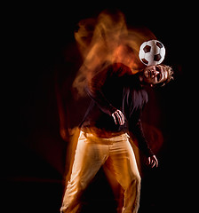 Image showing A portrait of a fan with ball on gray studio background. Freestile