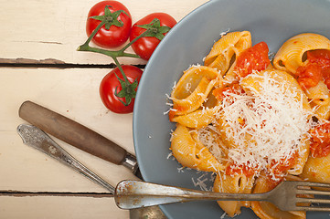 Image showing Italian snail lumaconi pasta with tomatoes