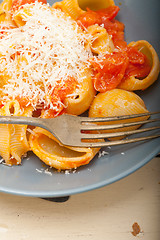 Image showing Italian snail lumaconi pasta with tomatoes