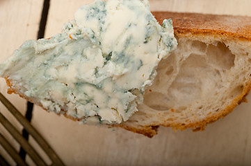 Image showing fresh blue cheese spread ove french baguette