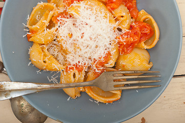 Image showing Italian snail lumaconi pasta with tomatoes