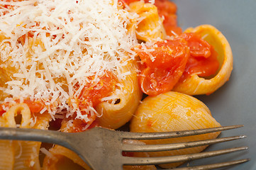 Image showing Italian snail lumaconi pasta with tomatoes