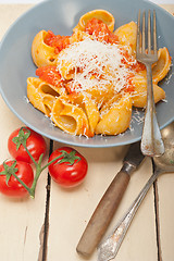 Image showing Italian snail lumaconi pasta with tomatoes