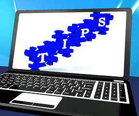 Image showing Tips Puzzle On Laptop Shows Internet Guide