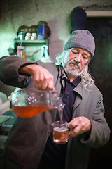 Image showing Man pouring wine