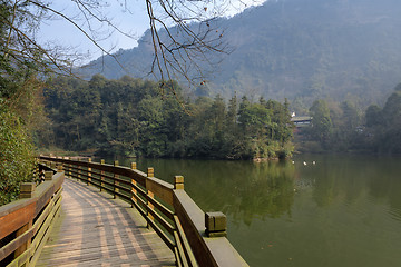 Image showing Large lake between mountains under sky