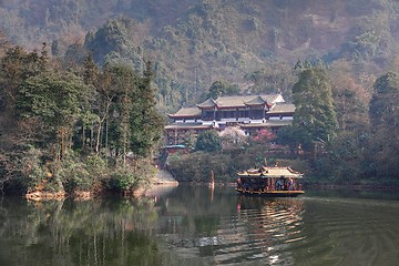 Image showing Large lake between mountains under sky