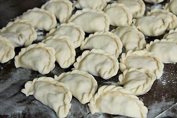 Image showing Dumplings on the dark kitchen board