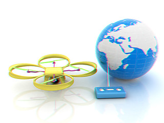 Image showing Quadrocopter Drone with Earth Globe and remote controller on a w