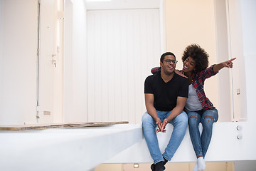 Image showing couple having break during moving to new house