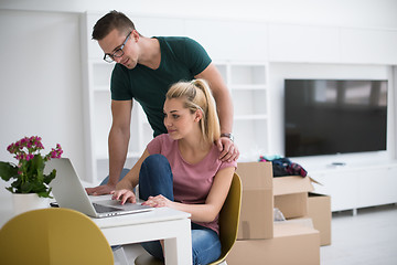 Image showing Young couple moving in a new home