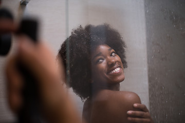 Image showing African American woman in the shower