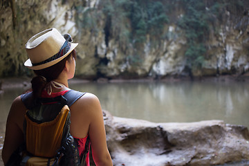 Image showing Brunette in hat among mountains