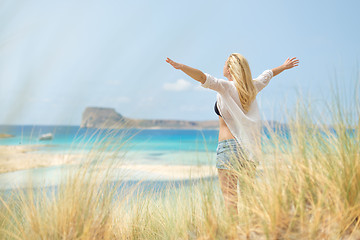 Image showing Free Happy Woman Enjoying Sun on Vacations.