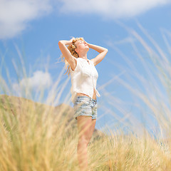 Image showing Free Happy Woman Enjoying Sun on Vacations.