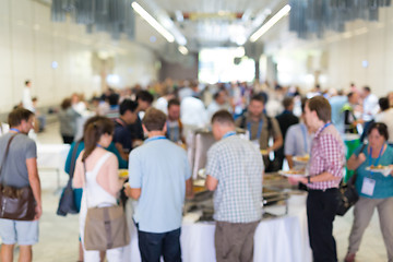 Image showing Abstract blurred people socializing during lunch break at business conference.