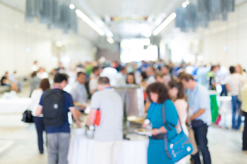 Image showing Abstract blurred people socializing during lunch break at business conference.