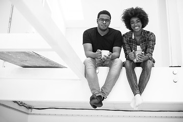 Image showing couple having break during moving to new house