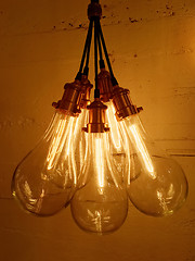Image showing Bunch of light bulbs on concrete background