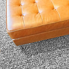 Image showing Leather seat on gray wool carpet