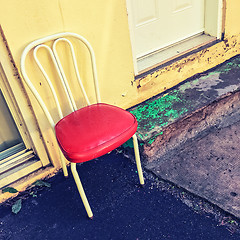 Image showing Bright chair outside the house