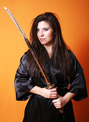 Image showing Dual Female holding a sword