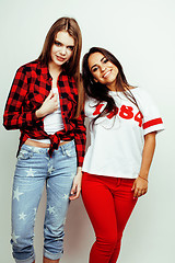 Image showing best friends teenage girls together having fun, posing emotional on white background, besties happy smiling, lifestyle people concept, blond and brunette multi nations 