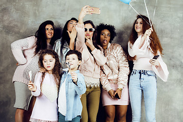 Image showing Lifestyle and people concept: young pretty diversity nations woman with different age children celebrating on birth day party together happy smiling, making selfie. African-american, asian and caucasi