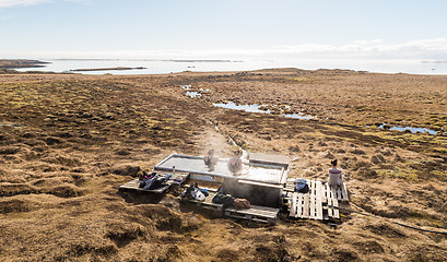 Image showing Icelandic hotpot among the amazing lagoon and mountains