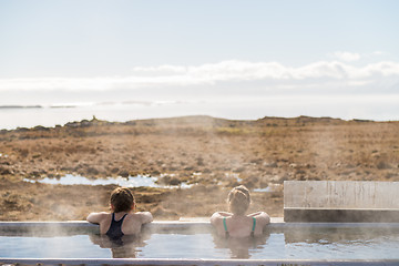 Image showing Icelandic hotpot among the amazing lagoon and mountains