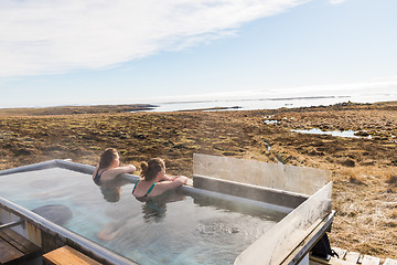 Image showing Icelandic hotpot among the amazing lagoon and mountains