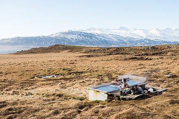 Image showing Icelandic hotpot among the amazing lagoon and mountains